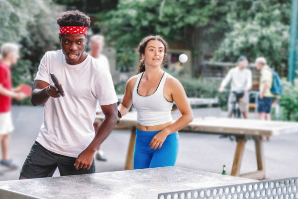 istock young people playing table tennis round around 1166599786