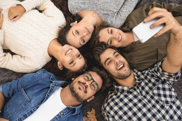 istock Friends making a groupe selfie 1166600684