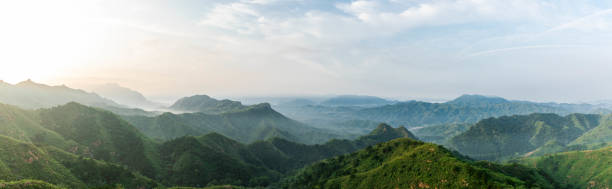 cloud and mountain landscape - layered mountain peak summer light imagens e fotografias de stock