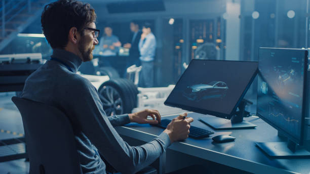 istock Professional Automotive Graphic Designer is Working on Concept Car Render with a Stylus Pen in a High Tech Innovative Laboratory with a Prototype Car Chassis. 1166603981