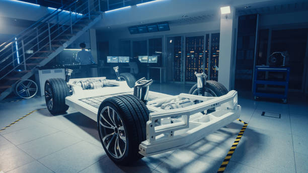 istock Concept of Authentic Electric Car Platform Chassis Prototype Standing in High Tech Industrial Machinery Design Laboratory. Hybrid Frame include Tires, Suspension, Engine and Battery. 1166604575