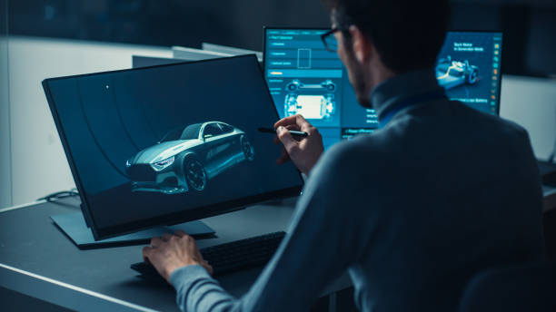 istock Professional Automotive Graphic Designer is Working on Concept Car Render with a Stylus Pen in a High Tech Innovative Laboratory with a Prototype Car Chassis. 1166604628