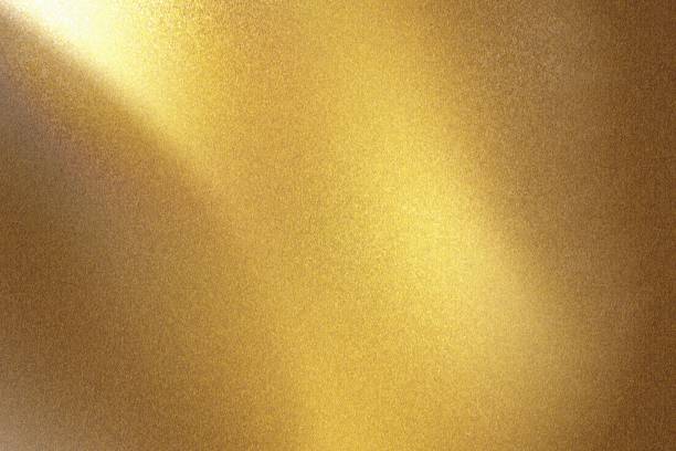 istock Glowing gold metal wall with scratched surface, abstract texture background 1166605996