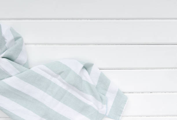 istock Green tablecloth on white wooden 1166606596
