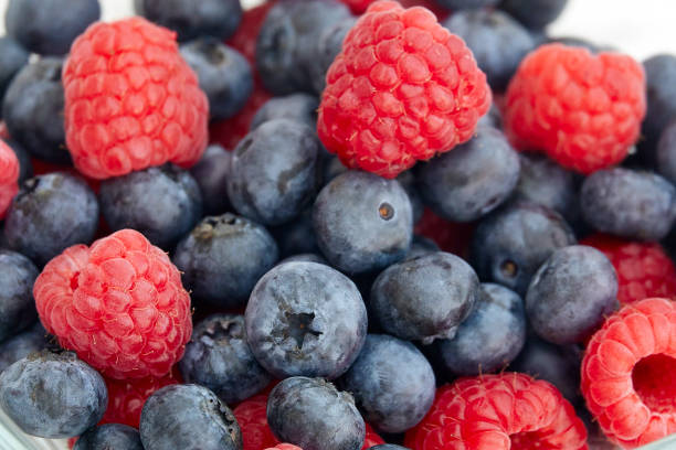 istock Blueberries and raspberries close up 1166607120