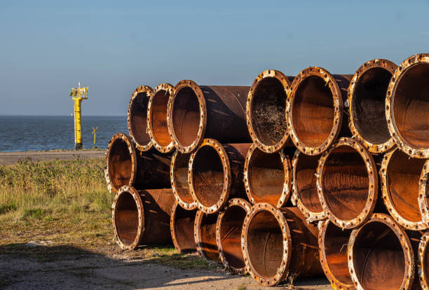 Close up photo of rusty metal pipes in a row as metal background.The pipes are arranged in horizontal composition.No people are seen in frame.Shot with medium format camera Hasselblad in daylight.