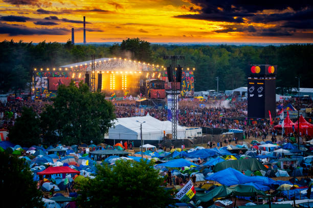 Pol'and'rock Festival 2019, Poland Kostrzyn Nad Odra, Poland - August 02, 2019:Aerial view of the huge campsite and afternoon concert on main stage with thousands young people at 25th Pol'and'rock Festival - the biggest open air ticket free rock music festival in Europe music festival camping summer vacations stock pictures, royalty-free photos & images