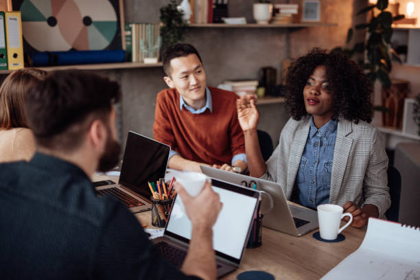 istock Female leader talking to her employees 1166610226
