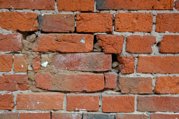 istock Texture of an old orange brick wall 1166611462