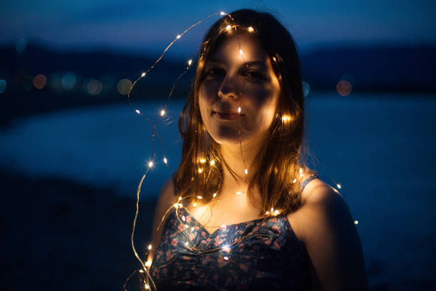 istock Girl enjoying sunset on a beach 1166611673