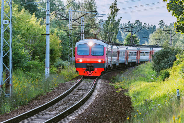 istock Passenger train moves through countryside, 1166612122