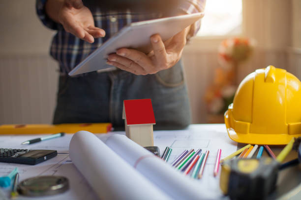 istock Concept Architect and desk of Architectural project in construction site or office building with mining light 1166613363