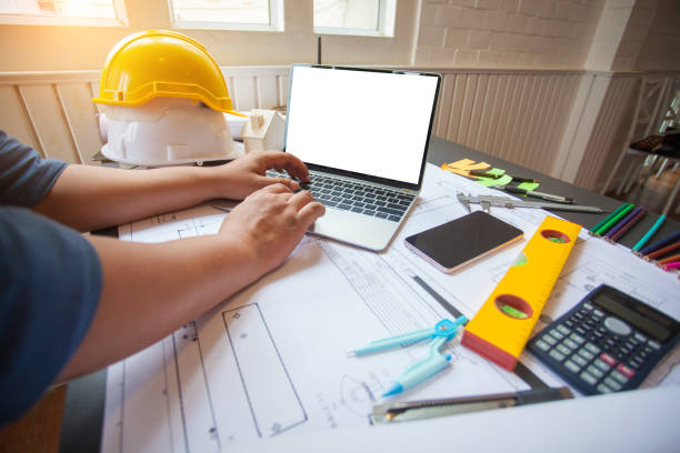 istock Concept Architect and desk of Architectural project in construction site or office building with mining light 1166613447