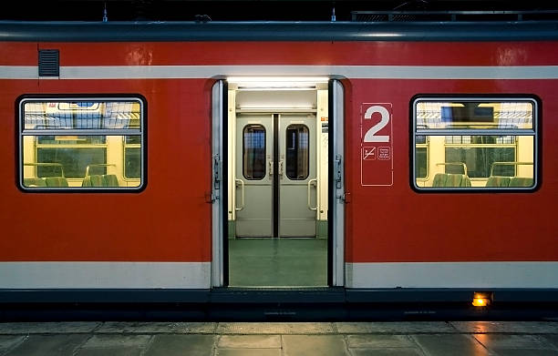 istock Red waiting train with doors open. Railroad station platfrom 116661469