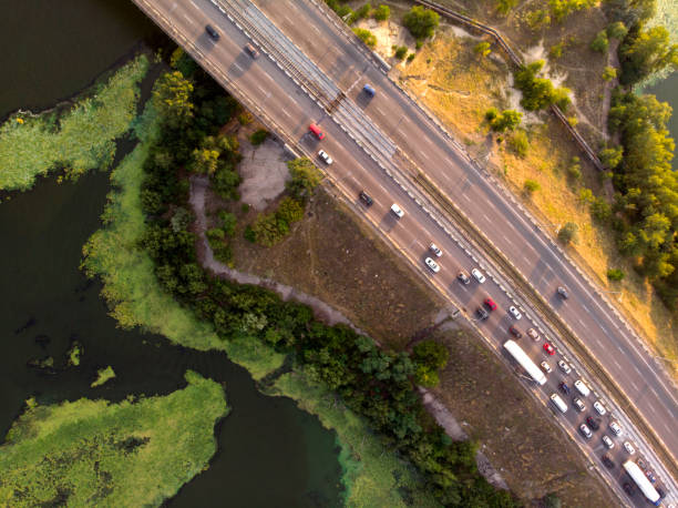 istock View from the drone to traffic on a bridge over a river. 1166615262