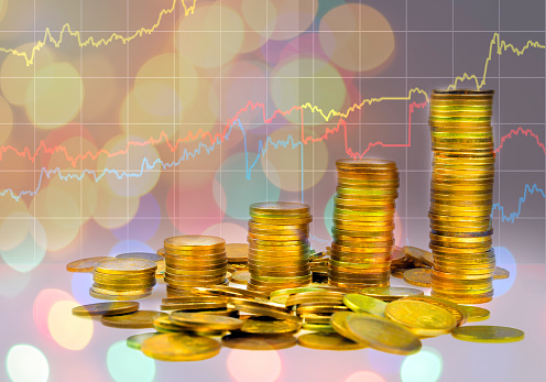 graph and rows of coins for finance