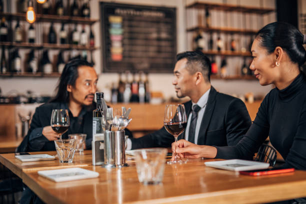 istock Business people in restaurant 1166617427
