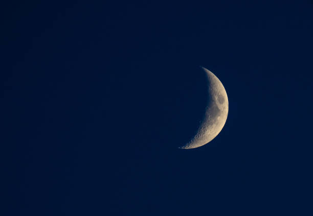 istock Nice young half moon on blue sky evening nature 1166617790