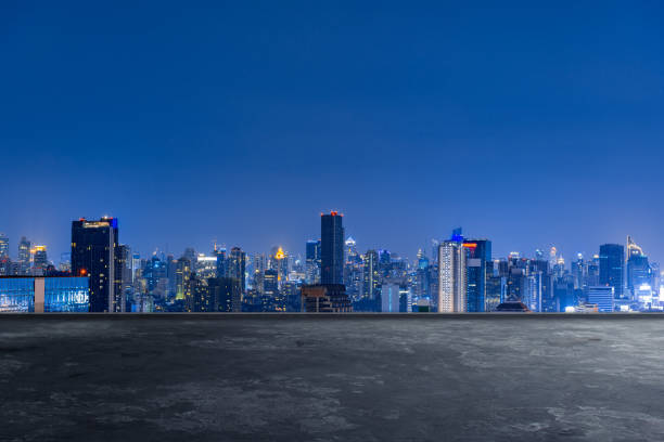 istock cityscape skyline night scene with empty floor on front 1166619101