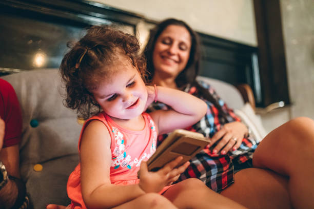 istock Little girl using phone 1166620373