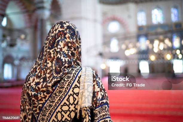 Woman In Headscarf Praying In A Mosque Istambul Turkey Stock Photo - Download Image Now