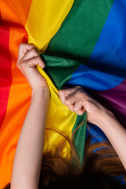 istock Young woman hands pulling pride flag sex orgasm concept 1166620693
