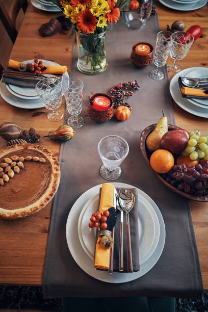 istock Decorated Table for Thanksgiving Dinner with Candles, Pumpkins, Leafs and Nuts 1166620707
