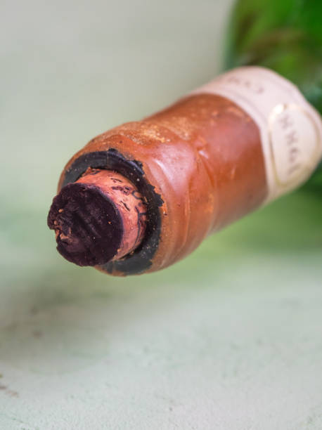 istock Very old wine, bottle neck with cork. 1166620728