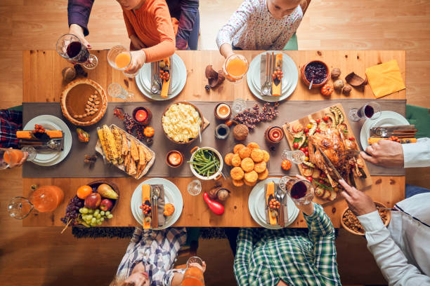 istock Family Having Traditional Holiday Stuffed Turkey Dinner 1166620810