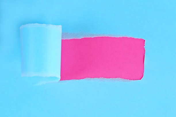 istock Torn color wrapped paper with space for message. Hole ripped in paper on background. Copy space 1166621577