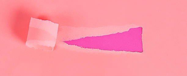 istock Torn color wrapped paper with space for message. Hole ripped in paper on background. Copy space 1166622171