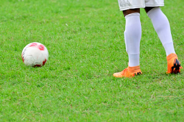 istock Boy kick soccer ball 1166622719