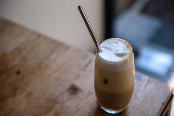 istock Iced latte with stainless steel straw on wooden table 1166623670