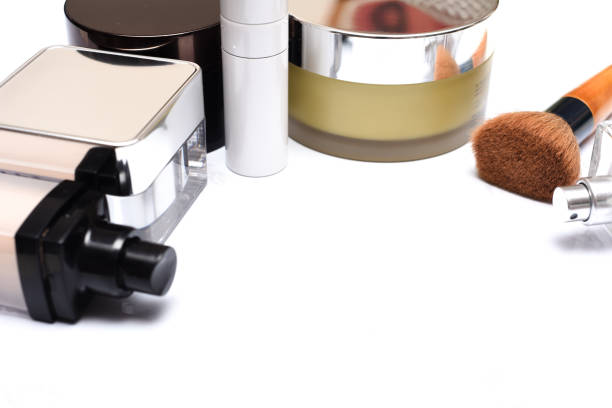 istock Makeup and cosmetic products with brush and perfume bottle on marble surface 1166624416