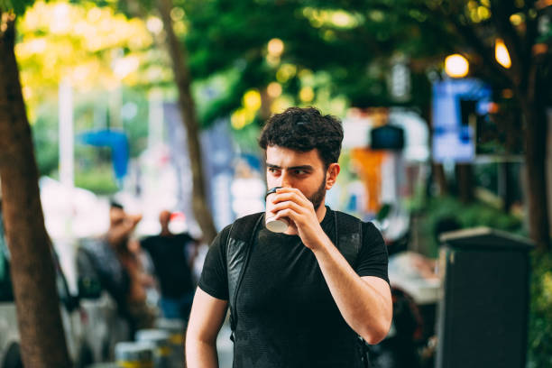 istock Urban Man Drinking Coffee in Cardboard Cup 1166626532