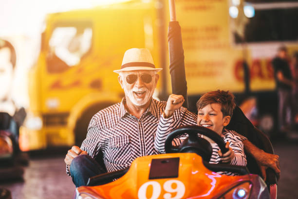 istock Grandfather and grandson amusement park fun 1166630549