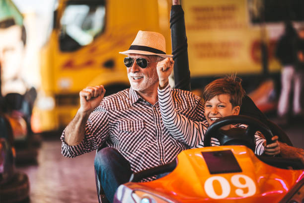 istock Grandfather and grandson amusement park fun 1166630570