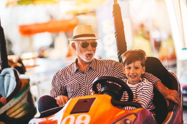 istock Grandfather and grandson amusement park fun 1166630634
