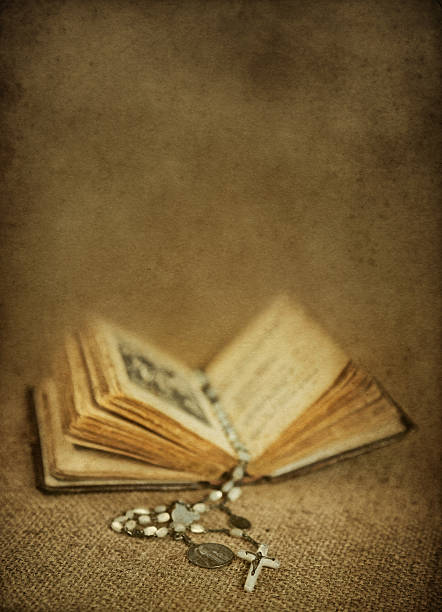 istock old prayer book with rosary 116663157