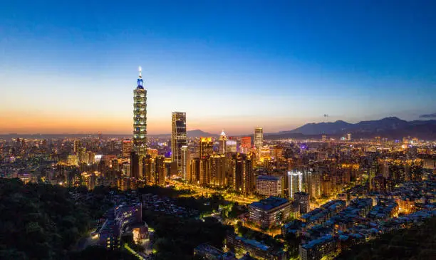 A high angle view over the city of Taipei at dusk.