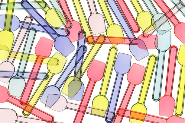 Background of pastel plastic ice crem spoons