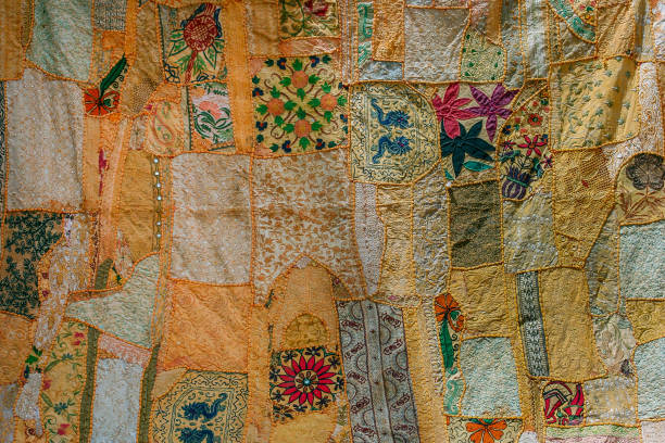 istock Jaisalmer, Rajasthan, India: pacthwork of yellow colored fabrics 1166633178