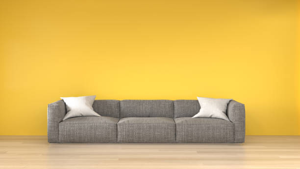 istock Sofa in front of the yellow empty wall 3d rendering modern home design,mouckup element for graphic design 1166635052
