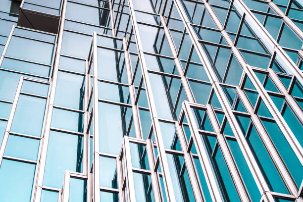 istock underside panoramic and perspective view to steel blue glass high rise building skyscrapers, business concept of successful industrial architecture 1166635207