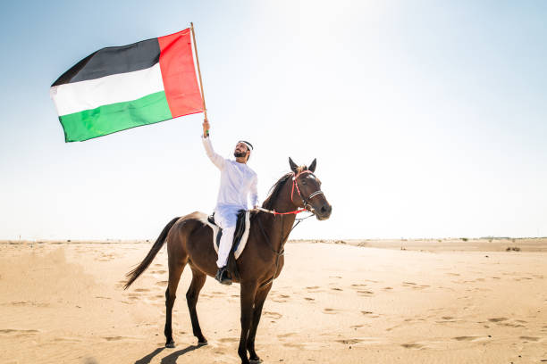 istock Arabian man with horse in the desert 1166635230