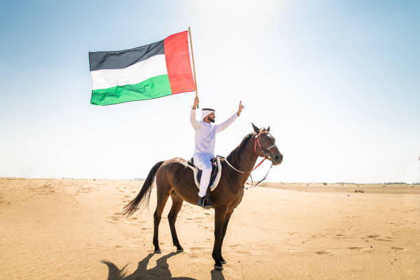 istock Arabian man with horse in the desert 1166636062