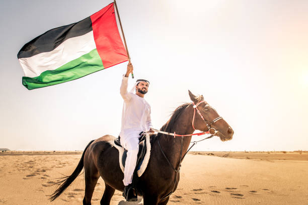 istock Arabian man with horse in the desert 1166636186