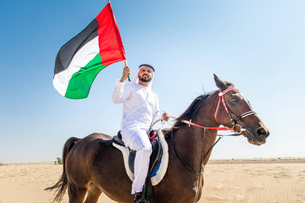 istock Arabian man with horse in the desert 1166636526