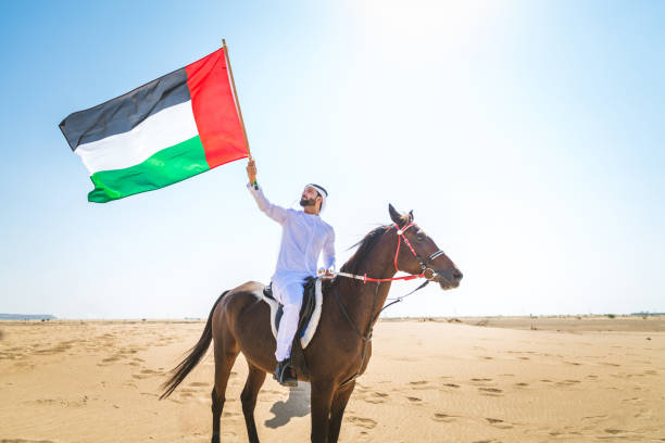 istock Arabian man with horse in the desert 1166636544