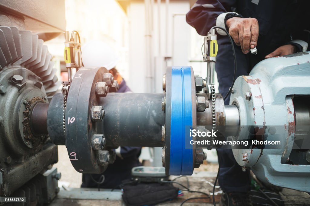 Maintenance Technician inspector alignment pump  and electric motor, Repairing work in factory concept Order Stock Photo